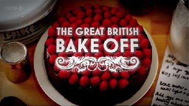 Red cake with white lettering, the great british bake off