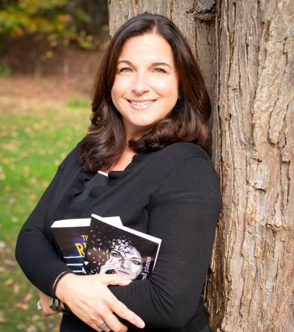 White women wearing black shirt holding two books